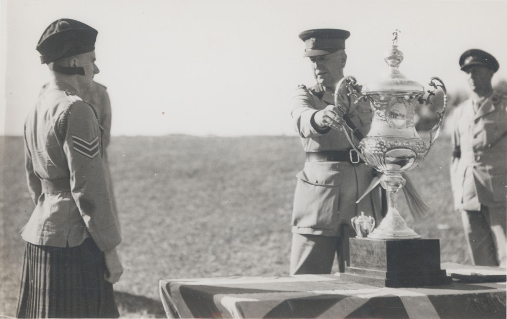 Cadet Officers and NCOS with Sergeant Ken Anketell receiving the Shooting Cup Trophy, 1944