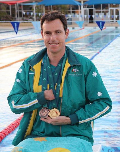 paul-barnett-with-medals-edit.jpg