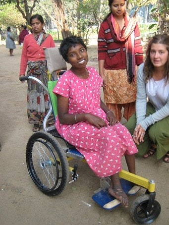 Occupational Therapist, Tarin Dempers with Animika in her new wheelchair.