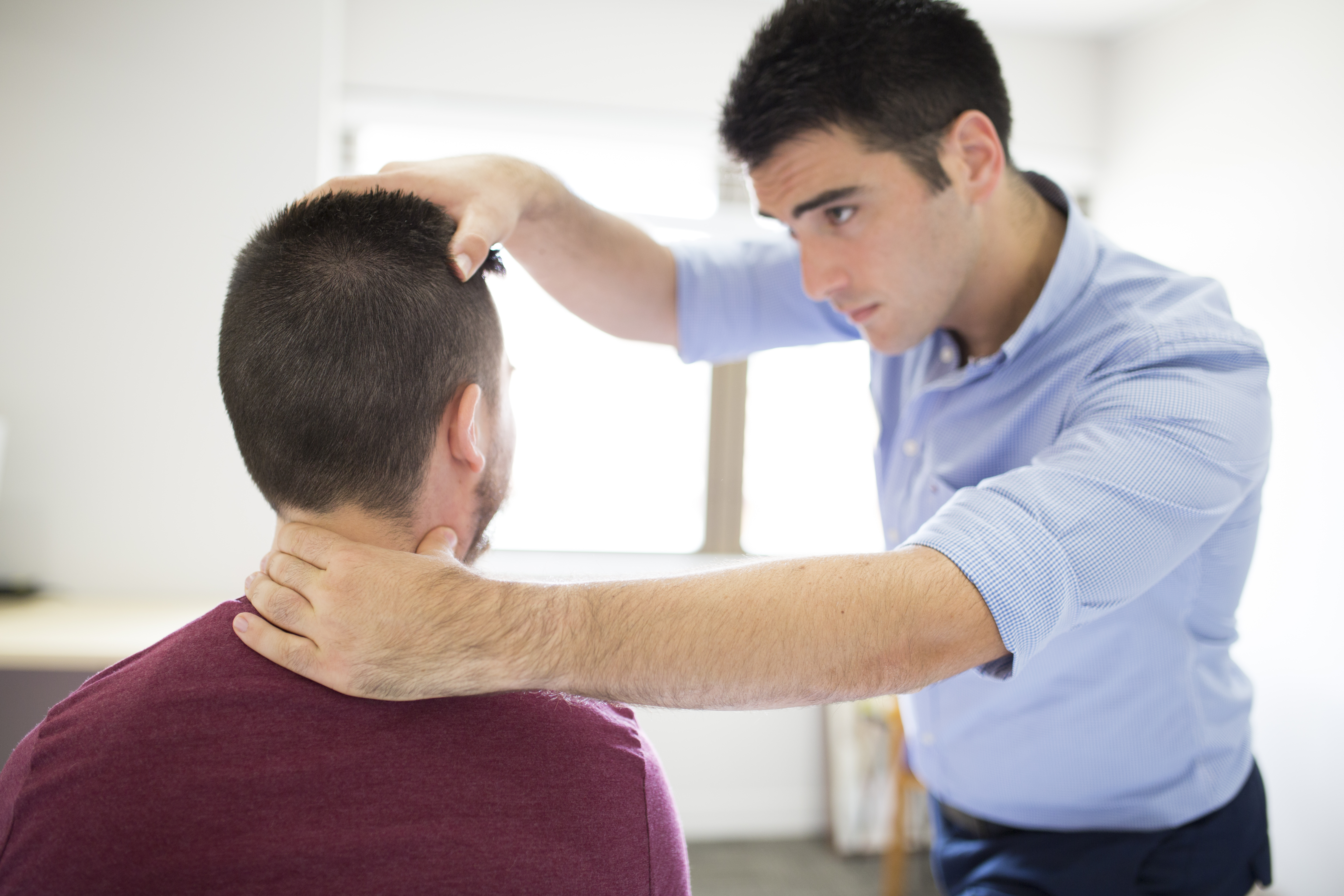 Physiotherapist treating patient